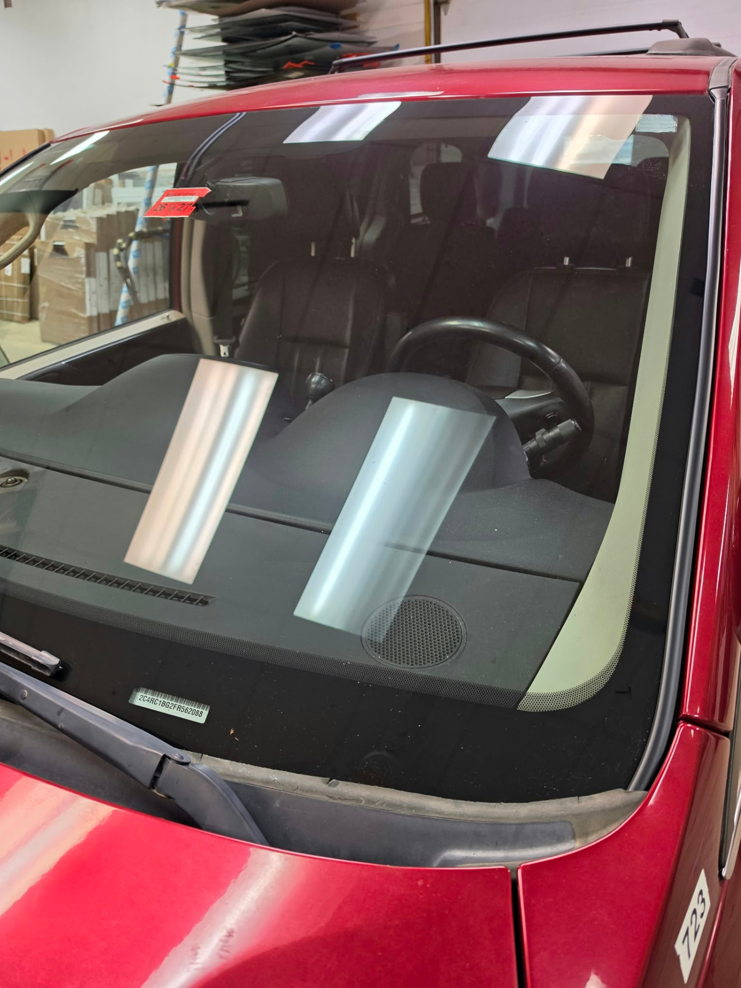 Installed windshield on a red vehicle